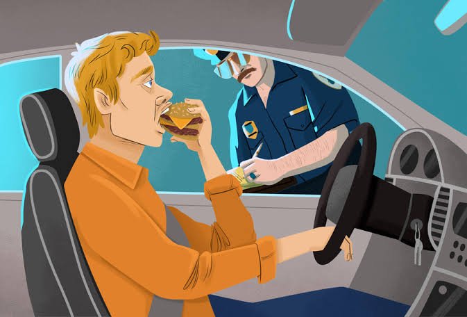 is eating while driving legal